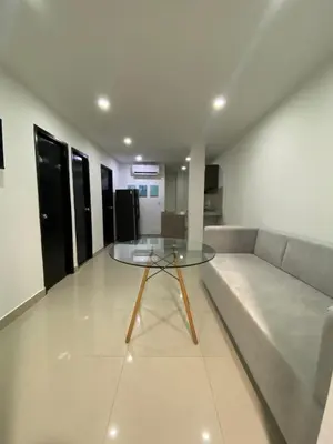 a living room with a couch and a glass table at Apartamento Para 6 Pax En La Boquilla VIAMAR in Cartagena de Indias