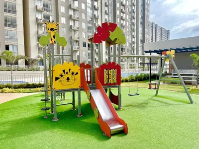 a playground with a slide in a park at Relax with a views, massage chairs and coffee station in Barranquilla