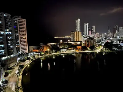 a city at night with a bridge over a river at Apto luxury en el laguito edificio marina del rey cartagena frente al mar in Cartagena de Indias