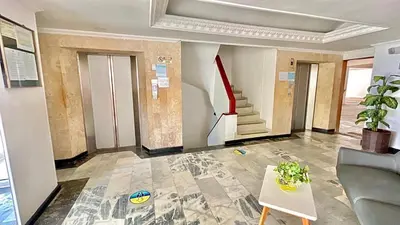 a living room with a staircase and a table at Apto luxury en el laguito edificio marina del rey cartagena frente al mar in Cartagena de Indias