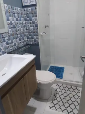 a bathroom with a toilet and a shower and a sink at VISTA CARIBE- apartamento piso 25, marbella in Cartagena de Indias