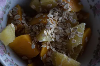 a bowl of food with fruit and nuts on it at CARDUMEN Arte y Cocina in Playa Blanca