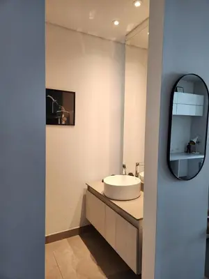 a bathroom with a sink and a mirror at Suite 1010 - Ocean View - Distrito90 in Barranquilla