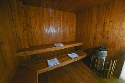 a wooden room with a bench in a sauna at Incredible 2BR with AC in Ciudad Amurallada in Cartagena de Indias