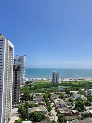 a view of a city with buildings and the ocean at Alojamiento Nuevo en Piso 24 con WiFi Rápido y Vista al Mar, Cerca al Centro Histórico in Cartagena de Indias