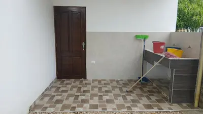 a room with a door and a tiled floor at Hospedaje MangleRojo - Cerca al Mar in Coveñas