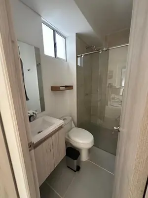 a bathroom with a toilet and a sink and a shower at Cartagena Vibes-Apartamento Serena del Mar in Cartagena de Indias