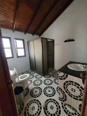 a bathroom with a toilet and a sink at Victoria Real in Coveñas