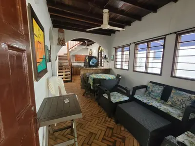 a living room with a couch and a table at Victoria Real in Coveñas