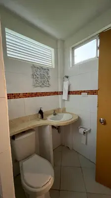 a bathroom with a toilet and a sink at Punta Manzanillo in San Bernardo del Viento