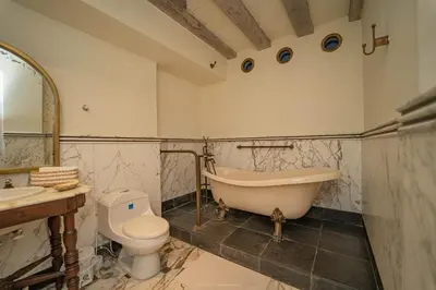 a bathroom with a tub and a toilet and a sink at Niña Maria pool House Plaza San Diego, Downtown! in Cartagena de Indias