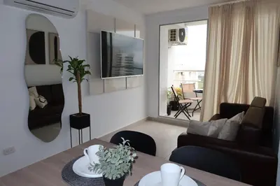 a living room with a couch and a table at Piso 32 Vista al mar y centro histórico in Cartagena de Indias