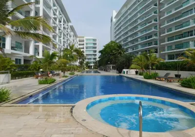 a swimming pool in the middle of some buildings at Apartamento Morros 3 Cartagena, Piscina Playa y Mar in Cartagena de Indias