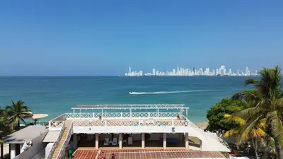 a view of the beach and the city at Dorado Beach Isla in Playa Punta Arena