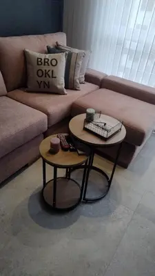 a living room with two tables in front of a couch at Barranquilla Dreams in Puerto Colombia