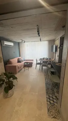 a living room with a couch and a table at Barranquilla Dreams in Puerto Colombia