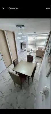 a dining room with a table and chairs in a room at Apartamento, Barranquilla - Miramar in Barranquilla