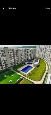 a large apartment building with a pool in front of it at Apartamento, Barranquilla - Miramar in Barranquilla