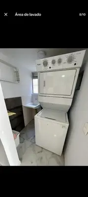 a kitchen with a stove top oven in a room at Apartamento, Barranquilla - Miramar in Barranquilla