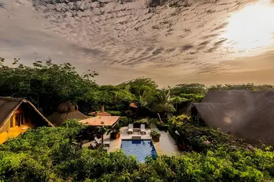 an aerial view of a resort with a pool and trees at Tita Tati Disconnect near Cartagena in Punta Canoas