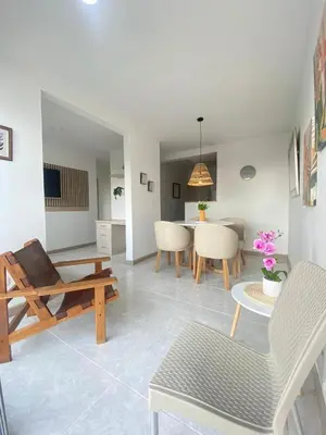 a living room with a table and some chairs at Cartagena Chic Full Apto in Cartagena de Indias