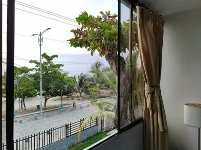 a window with a view of a street at Habitacion frente al mar en Tolú in Santiago