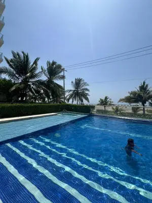 a person swimming in a swimming pool at Morros Vitri directo al Mar in Cartagena de Indias