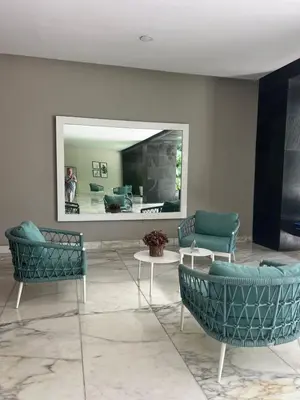 a room with chairs and a mirror in a room at Morros Vitri directo al Mar in Cartagena de Indias