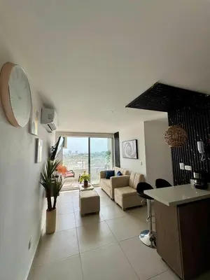 a living room with a couch and a table at Villas del mar in Cartagena de Indias