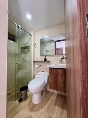 a bathroom with a toilet and a glass shower at Villas del mar in Cartagena de Indias