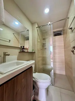 a bathroom with a toilet and a sink and a shower at Villas del mar in Cartagena de Indias