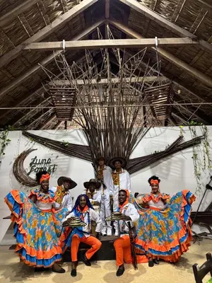 a group of people in costumes standing in front of a wall at Ekoparque Lunaforest in Guayepo
