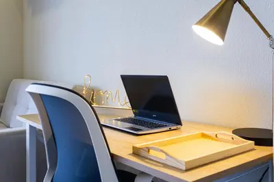 a laptop computer sitting on top of a desk at Modern Apartment Cielo Mar Terrace-Pool-Jacuzzi Close to the beach in Cartagena de Indias