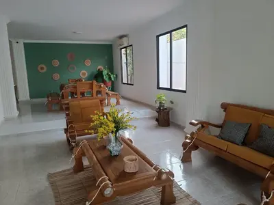 a living room with a couch and a table at La Trinidad in Santa Veronica