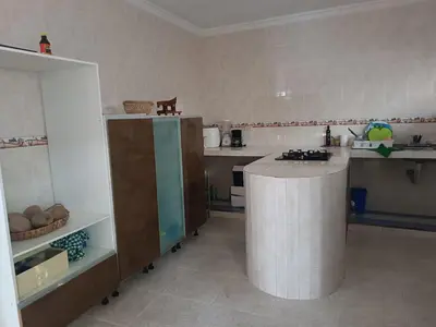 a kitchen with a counter and a counter top at La Trinidad in Santa Veronica