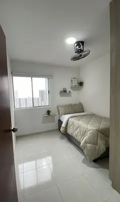 a bedroom with a bed and a window at apartamento cerca de la playa in Cartagena de Indias