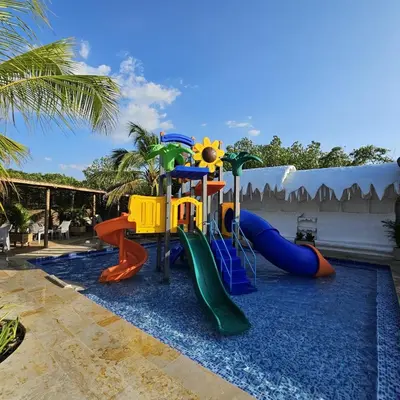 a childrens playground with a slide and a play structure at Aves de Laguna Beach