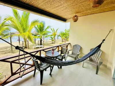 a hammock in a room with a view of the beach at Aves de Laguna Beach