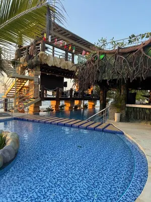 a swimming pool at a resort with a slide at Aves de Laguna Beach in Trementino