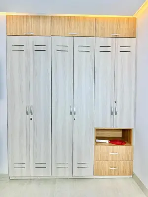 a row of white lockers in a room at Aves de Laguna Beach in Trementino