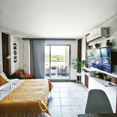 Modern suite steps from the sea