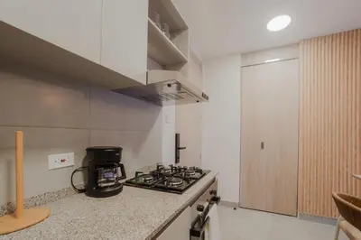 a kitchen with a stove and a counter top at Coastal Comfort Retreat Beach stay Near Airport in Santa Marta