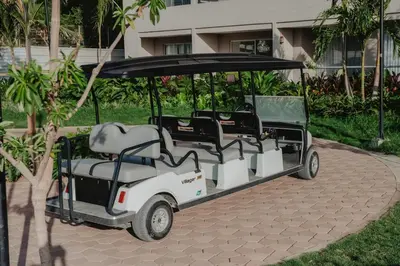 a golf cart is parked on a patio at Coastal Comfort Retreat Beach stay Near Airport in Santa Marta