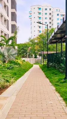 a brick path in a city with tall buildings at Seaside Retreat Beach Entrance 20th Floor in Santa Marta