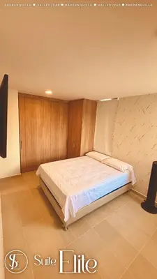 a bedroom with a large bed in a room at Barranquilla Super Suite Elite in Barranquilla
