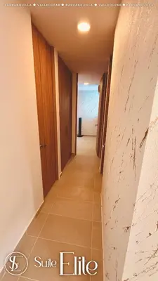 a corridor of a room with a long hallway at Barranquilla Super Suite Elite in Barranquilla