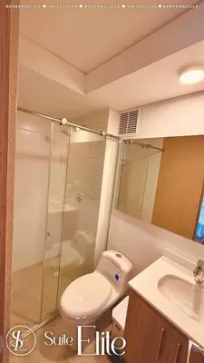 a bathroom with a shower and a toilet and a sink at Barranquilla Super Suite Elite in Barranquilla