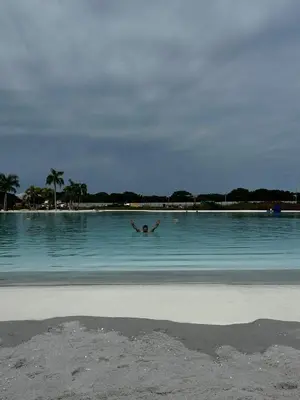 a man swimming in a large body of water at Baia Kristal Andrés Cartagena in Cartagena de Indias