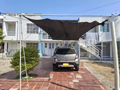 a small car parked in front of a house at Apartamento en Cartagena de Indias in Cartagena de Indias