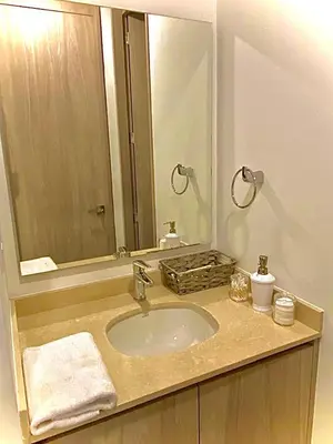 a bathroom with a sink and a large mirror at Anny Luxury Apartment - Santa Marina in Santa Marta